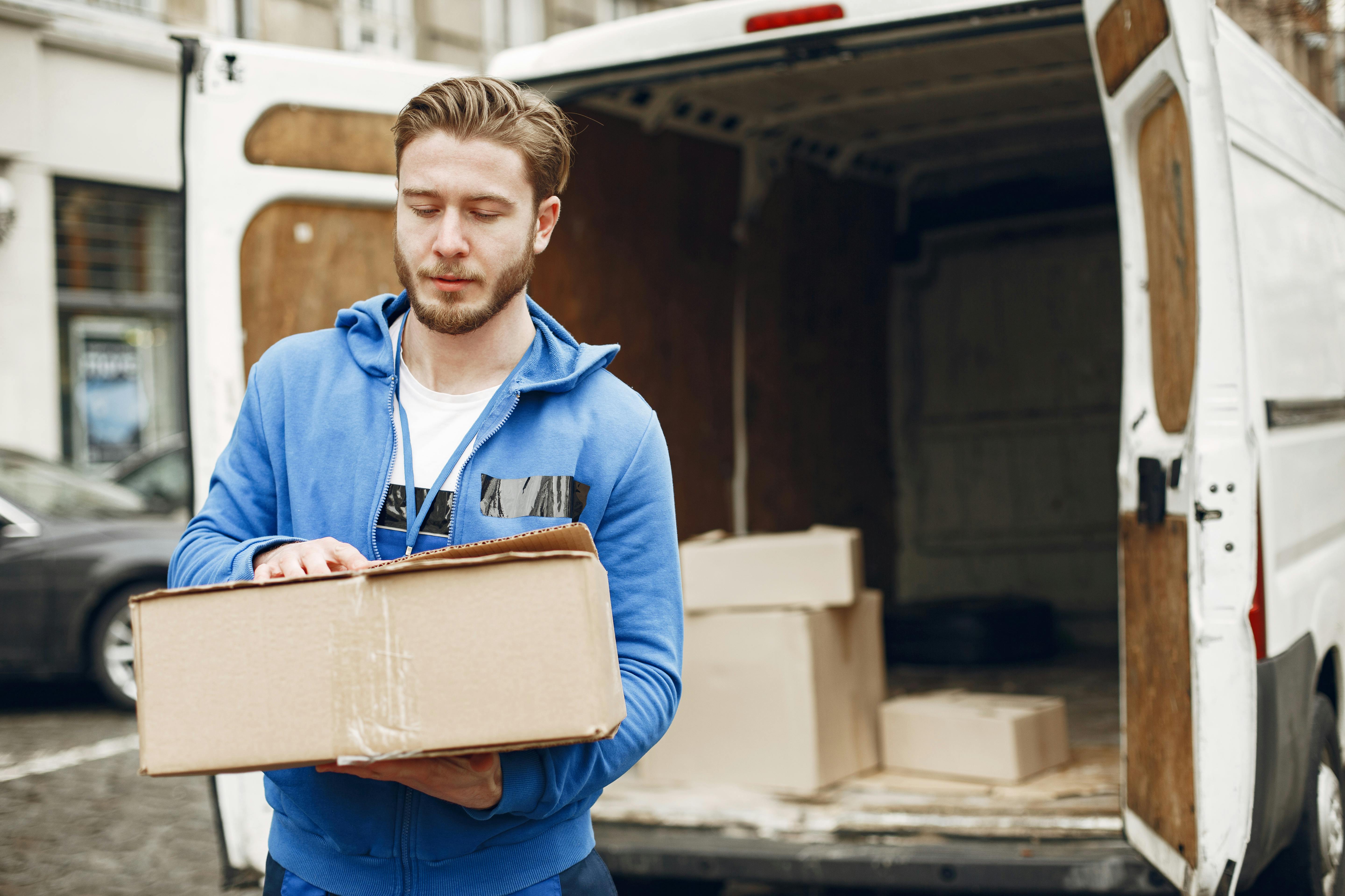 Professional delivery person with truck showcasing modern moving services