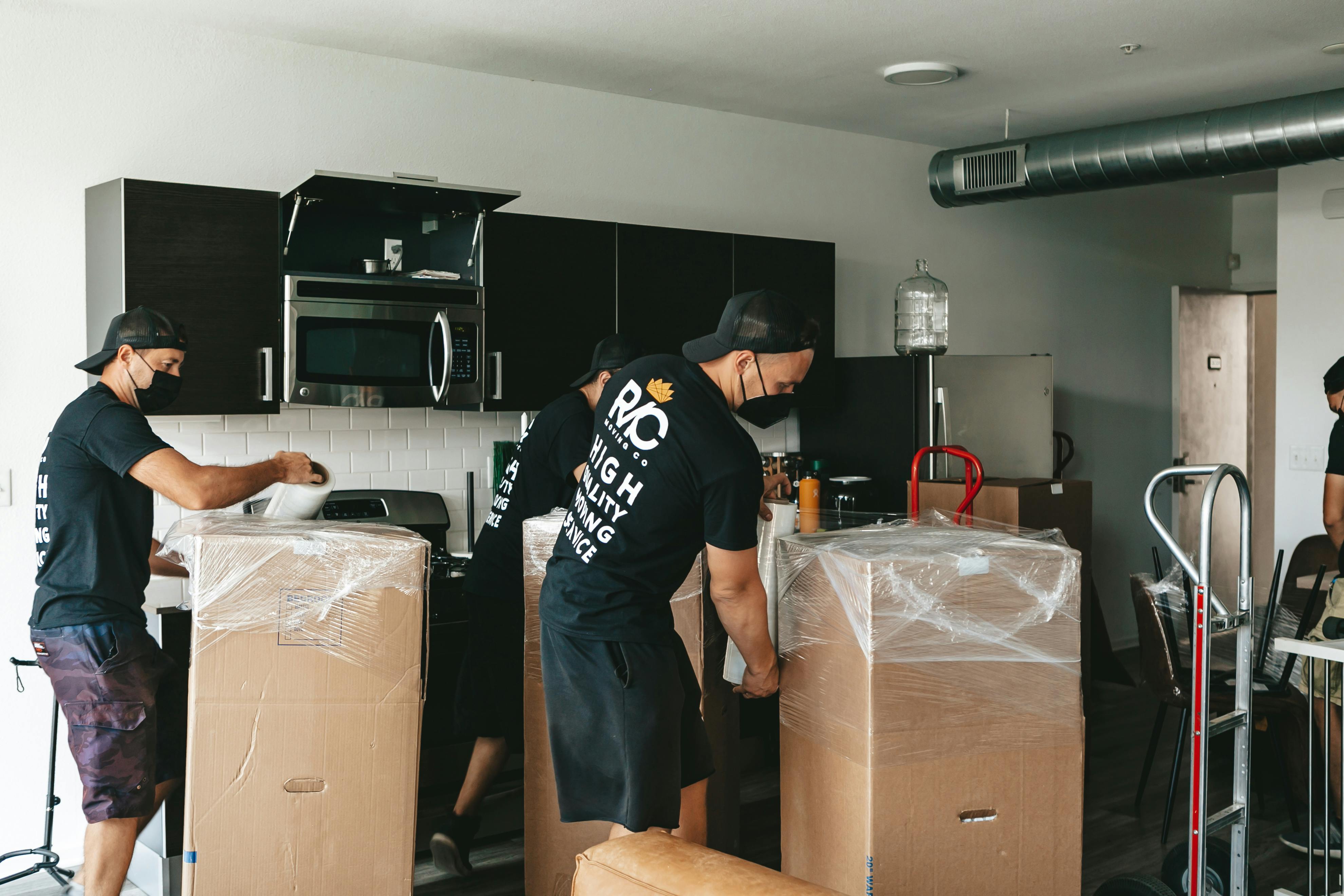Professional movers team efficiently organizing boxes